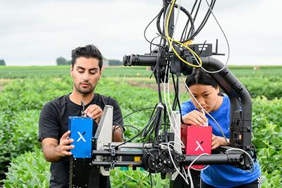 People using research equipment in field
